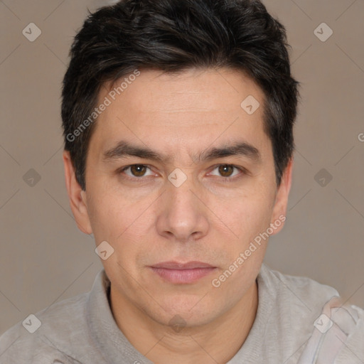 Joyful white adult male with short  brown hair and brown eyes