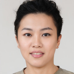 Joyful asian young-adult female with short  black hair and brown eyes