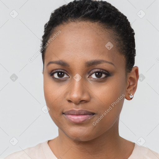 Joyful black young-adult female with short  black hair and brown eyes