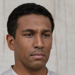 Neutral latino young-adult male with short  brown hair and brown eyes