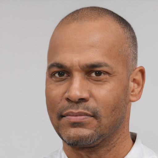 Neutral latino adult male with short  black hair and brown eyes