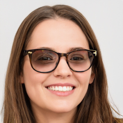 Joyful white young-adult female with long  brown hair and blue eyes