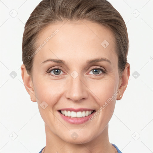 Joyful white young-adult female with short  brown hair and grey eyes