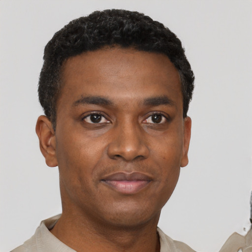 Neutral black young-adult male with short  black hair and brown eyes