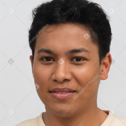 Joyful latino young-adult male with short  brown hair and brown eyes