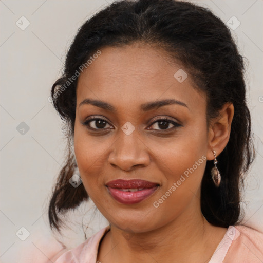 Joyful black young-adult female with medium  brown hair and brown eyes