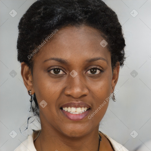 Joyful black young-adult female with short  black hair and brown eyes