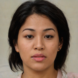 Neutral asian young-adult female with medium  brown hair and brown eyes