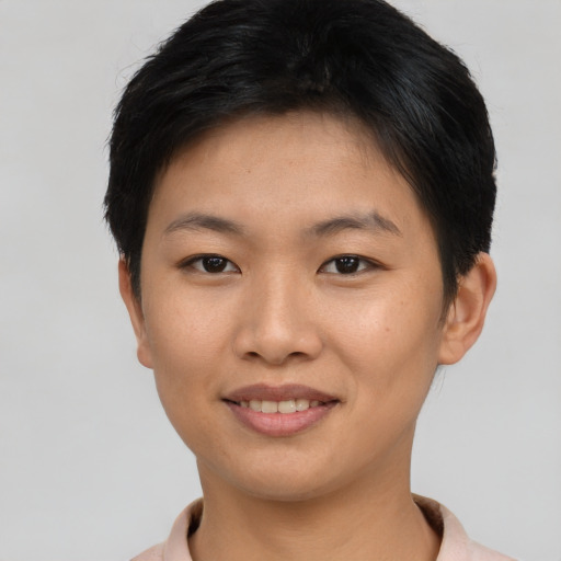 Joyful asian young-adult female with short  brown hair and brown eyes