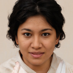 Joyful asian young-adult female with medium  brown hair and brown eyes