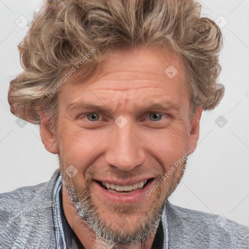 Joyful white adult male with short  brown hair and blue eyes