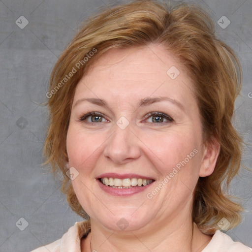 Joyful white adult female with medium  brown hair and blue eyes