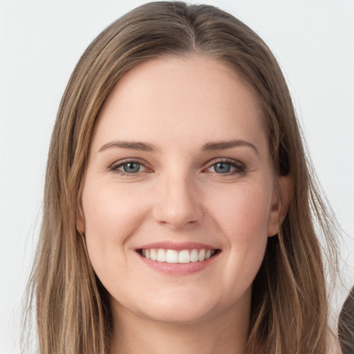 Joyful white young-adult female with long  brown hair and grey eyes