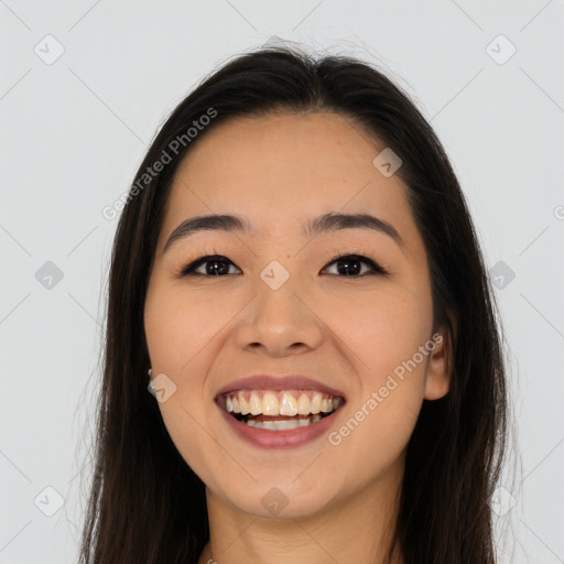 Joyful asian young-adult female with long  brown hair and brown eyes