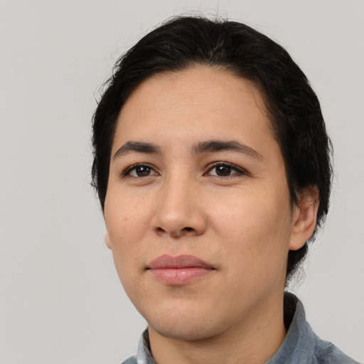 Joyful white young-adult female with short  black hair and brown eyes