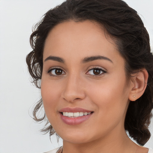 Joyful white young-adult female with medium  brown hair and brown eyes