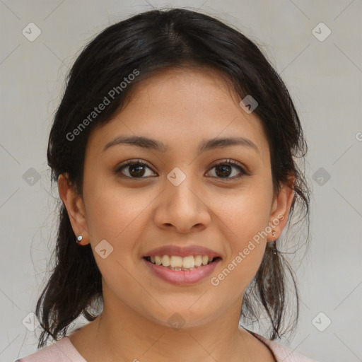 Joyful latino young-adult female with medium  brown hair and brown eyes