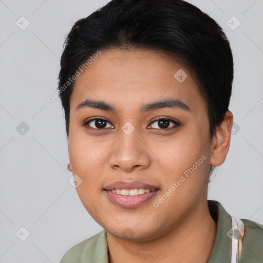 Joyful asian young-adult female with short  black hair and brown eyes