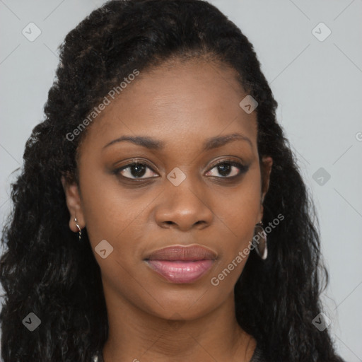 Joyful black young-adult female with long  brown hair and brown eyes