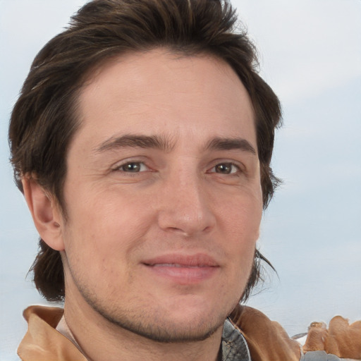 Joyful white adult male with short  brown hair and brown eyes