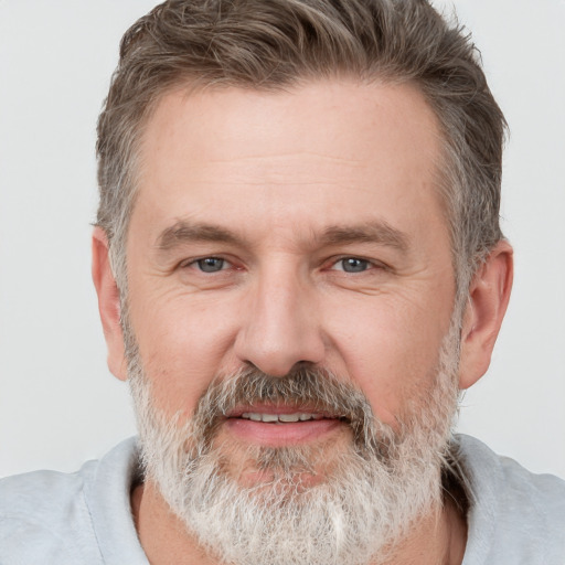 Joyful white adult male with short  brown hair and grey eyes