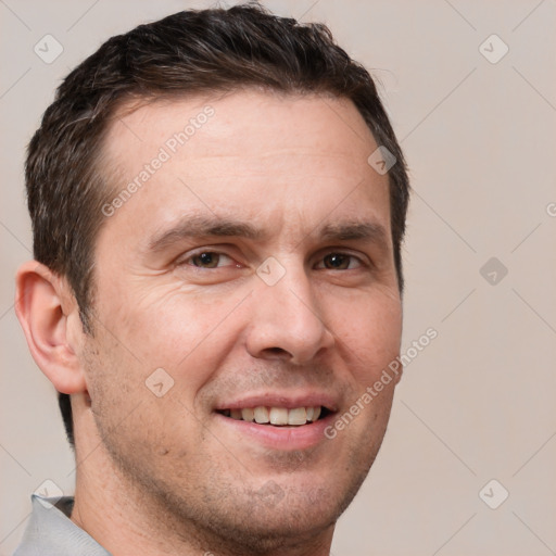 Joyful white adult male with short  brown hair and brown eyes