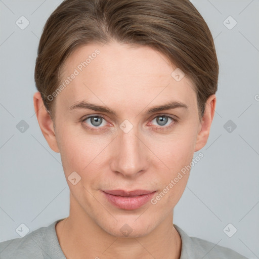 Joyful white young-adult female with short  brown hair and grey eyes