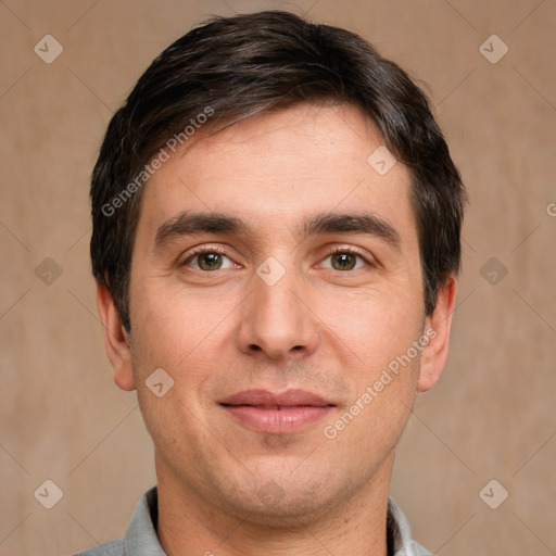 Joyful white adult male with short  brown hair and brown eyes