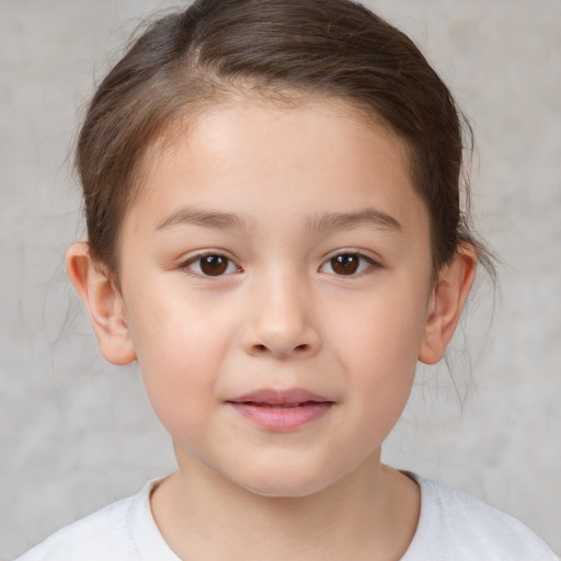 Joyful white child female with short  brown hair and brown eyes