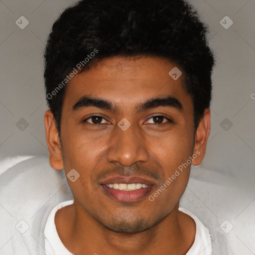 Joyful latino young-adult male with short  black hair and brown eyes