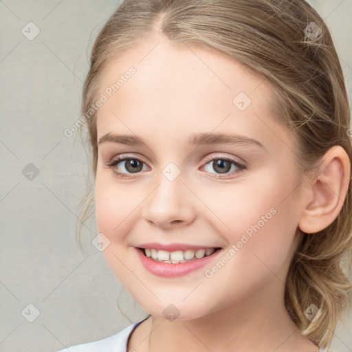 Joyful white child female with medium  brown hair and blue eyes