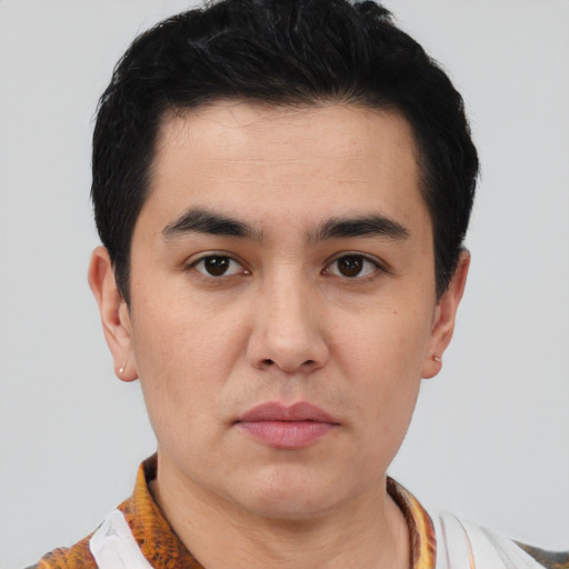 Joyful latino young-adult male with short  black hair and brown eyes