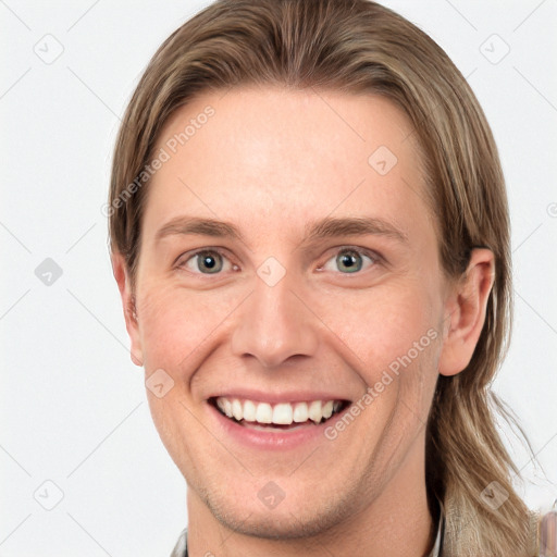 Joyful white young-adult female with long  brown hair and blue eyes