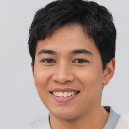 Joyful asian young-adult male with short  black hair and brown eyes