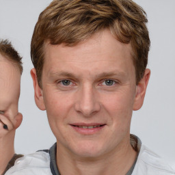 Joyful white adult male with short  brown hair and brown eyes