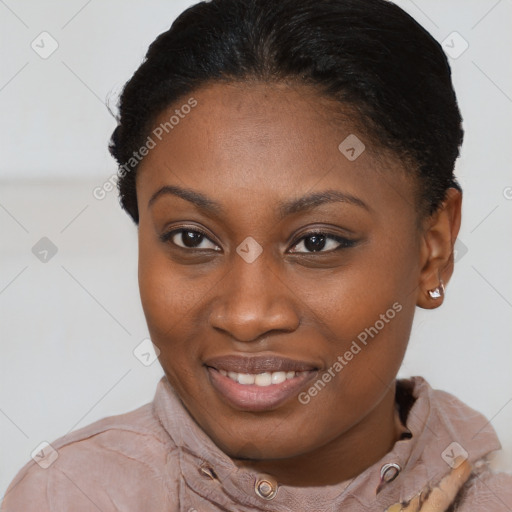 Joyful black young-adult female with short  brown hair and brown eyes