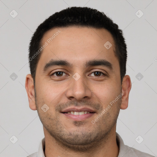 Joyful white young-adult male with short  black hair and brown eyes