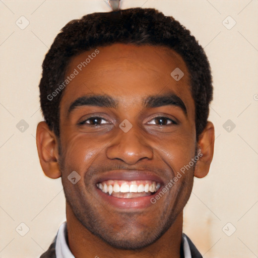 Joyful black young-adult male with short  black hair and brown eyes