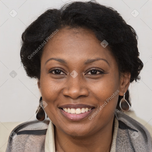 Joyful black adult female with medium  brown hair and brown eyes