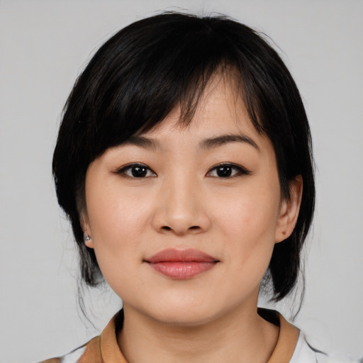 Joyful white young-adult female with medium  black hair and brown eyes