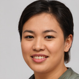 Joyful asian young-adult female with medium  brown hair and brown eyes