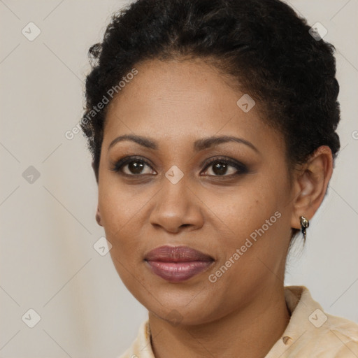 Joyful black young-adult female with short  brown hair and brown eyes