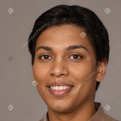 Joyful latino young-adult female with short  black hair and brown eyes