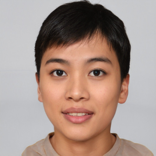 Joyful asian young-adult female with short  black hair and brown eyes