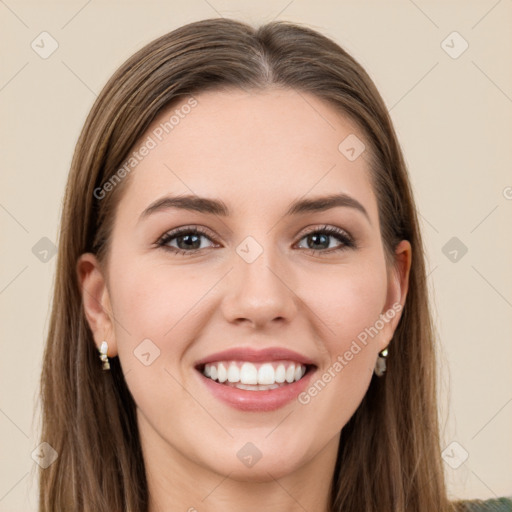 Joyful white young-adult female with long  brown hair and green eyes