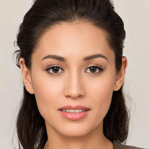 Joyful white young-adult female with long  brown hair and brown eyes