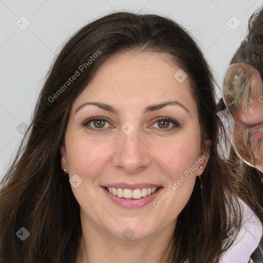 Joyful white adult female with long  brown hair and brown eyes