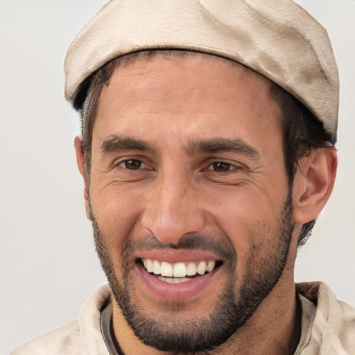 Joyful white young-adult male with short  black hair and brown eyes