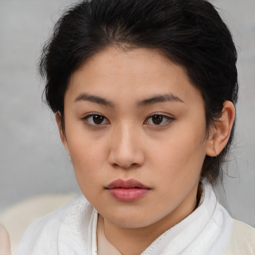 Neutral asian young-adult female with medium  brown hair and brown eyes