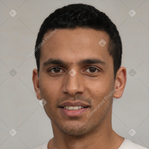 Joyful white young-adult male with short  black hair and brown eyes